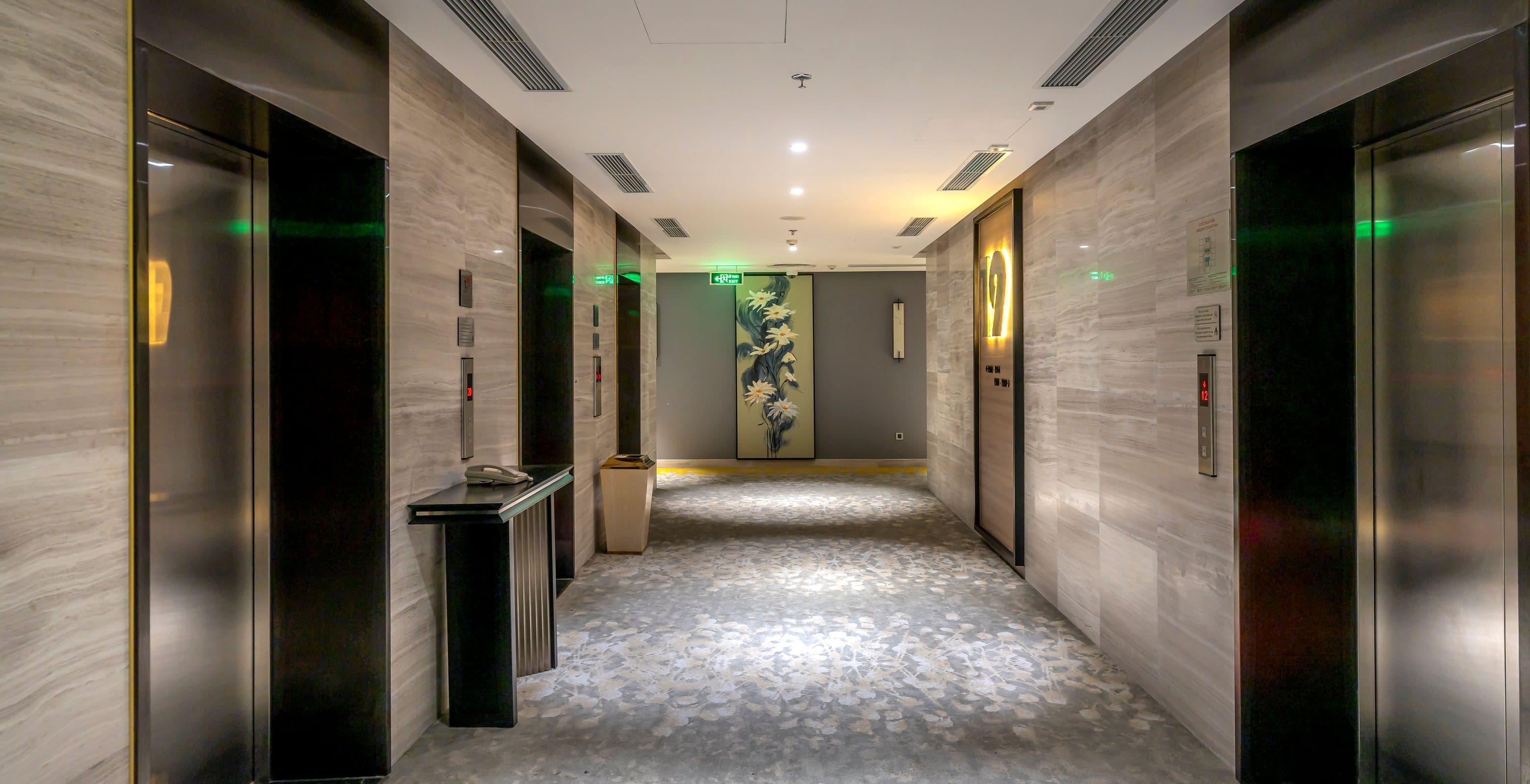 Marble lift lobby with doors facing each other